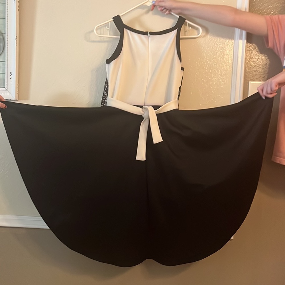 Size 16- Black and White romper with high-low wrap around skirt